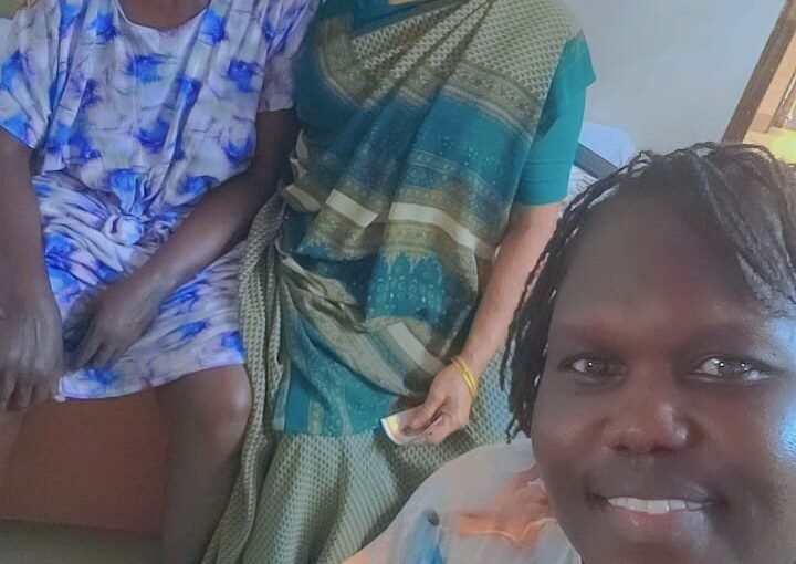 Photo of Champaben providing compassionate caregiving support to Kier Gideon Dau in a peaceful senior care center setting, symbolizing empathy, dedication, and humanity.